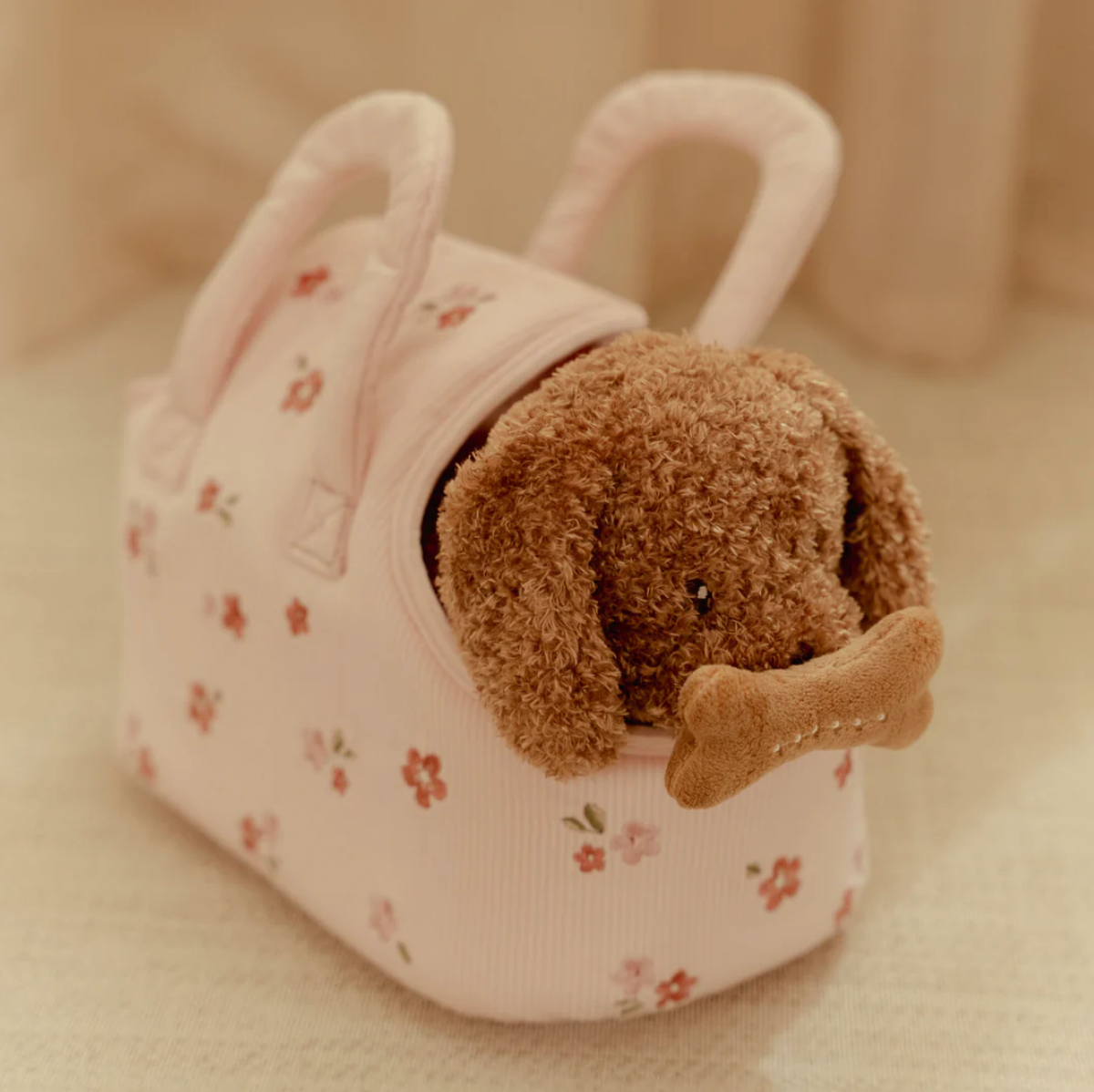 Plush dog toy with floral carry bag
