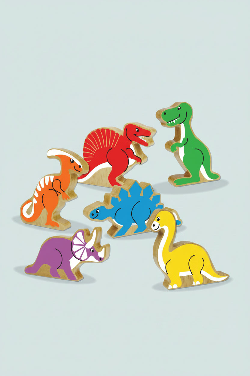 A set of colorful wooden dinosaur toy figures on a plain white background. The set includes a green T-rex, red spinosaurus, orange ornithopod, blue Stegosaurus, purple Triceratops, and yellow Brachiosaurus.