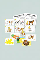 A set of children's farm-themed cards and worksheets shown on a white background. The cards feature illustrated farm animals such as cows, ducks, a rabbit, and a horse, along with simple scenes like carrots, hay, and shoes.