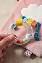 ring rattle on  rainbow for sensory noie