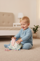 baby playing with different textures on taglet