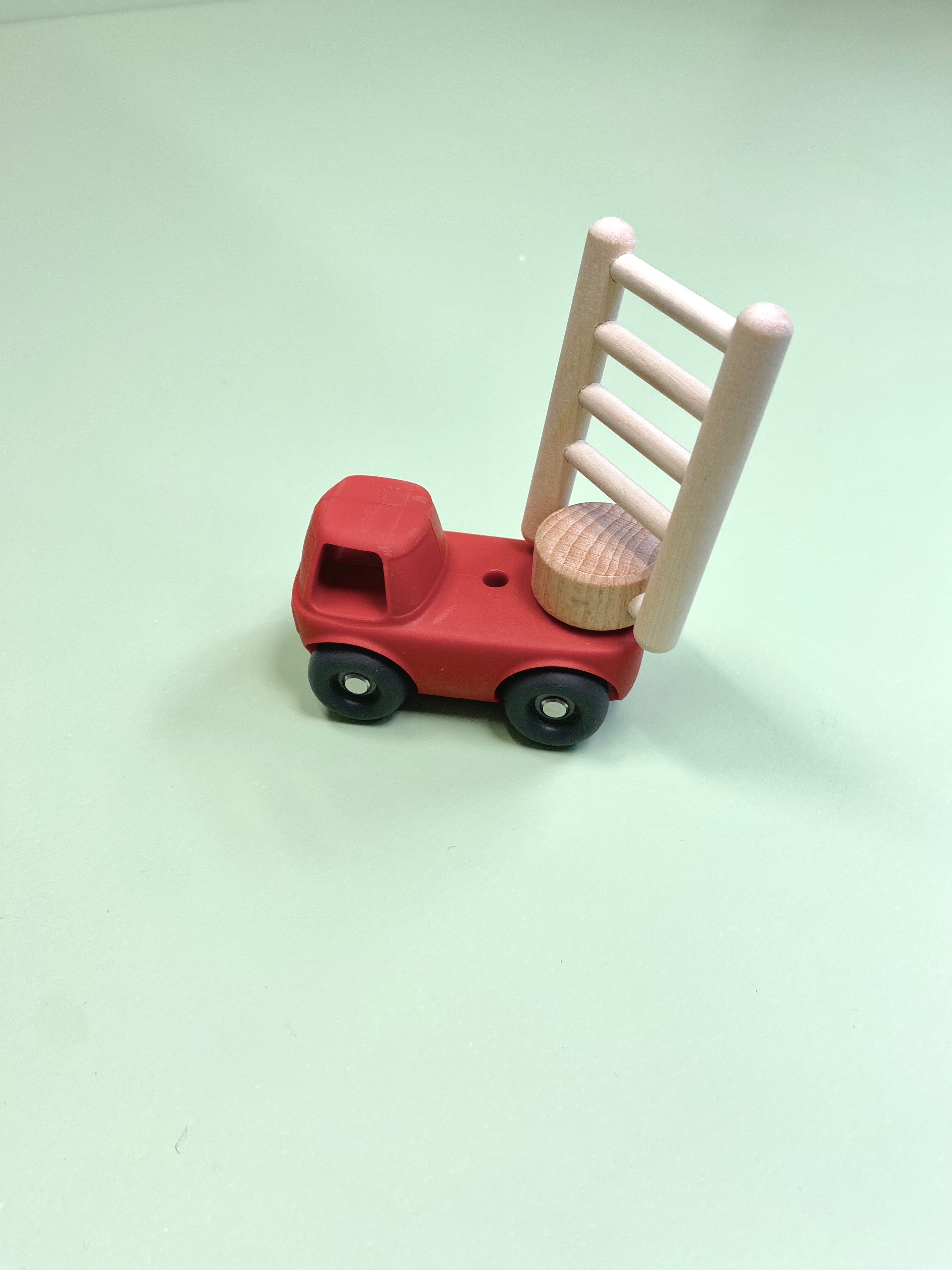 fire  truck with a wooden ladder on a light green background