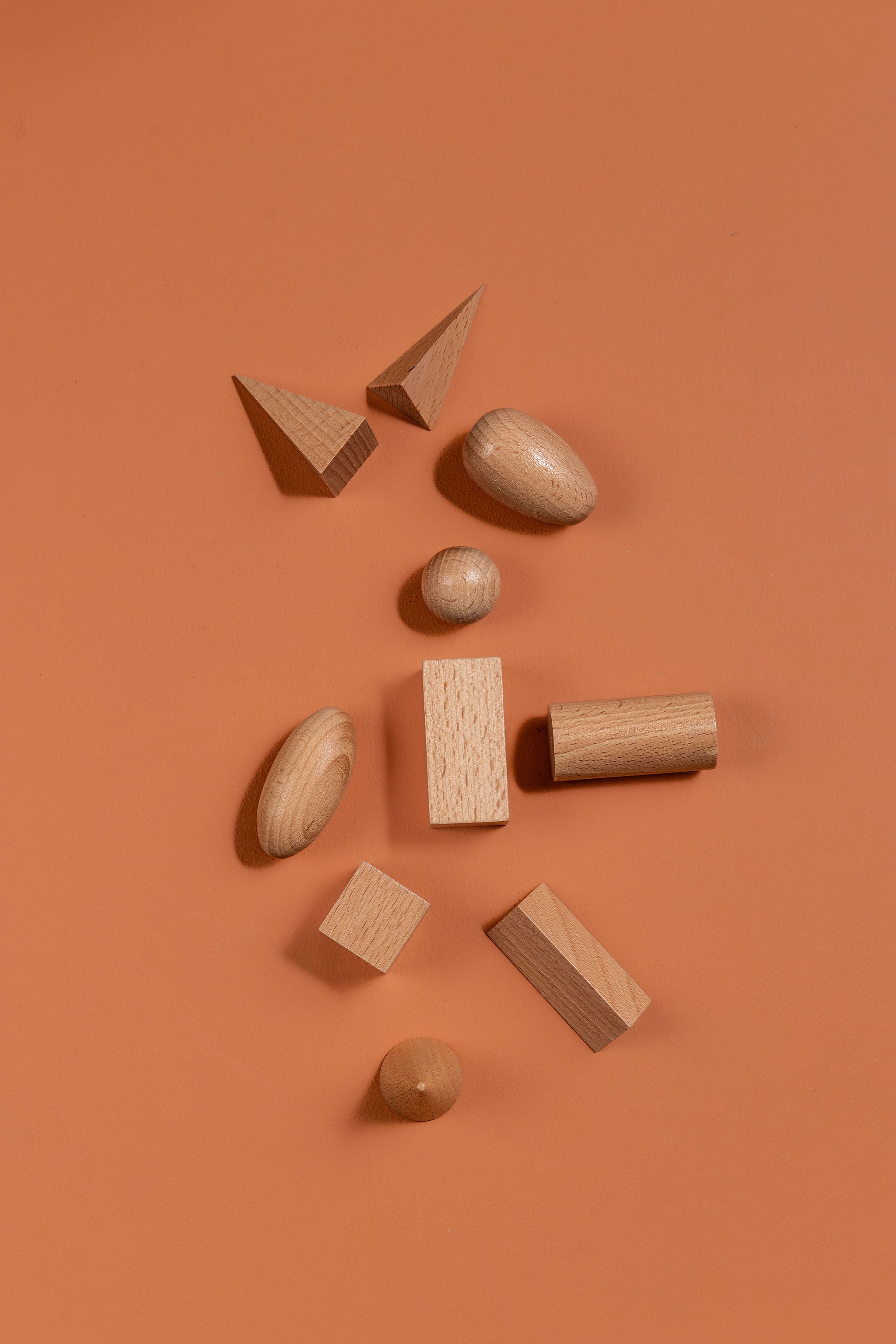 Montessori-inspired wooden geometric solids set