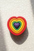 coloured nesting hearts on plin textured background