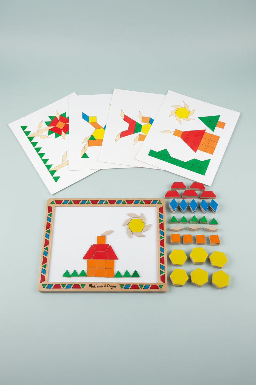 Educational toy set with wooden frame, colorful shapes, and cards on a white background
