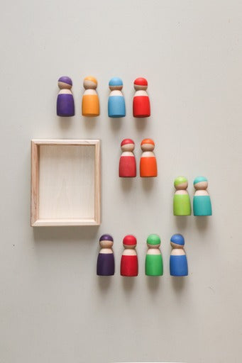 painted peg dolls around a wooden tray