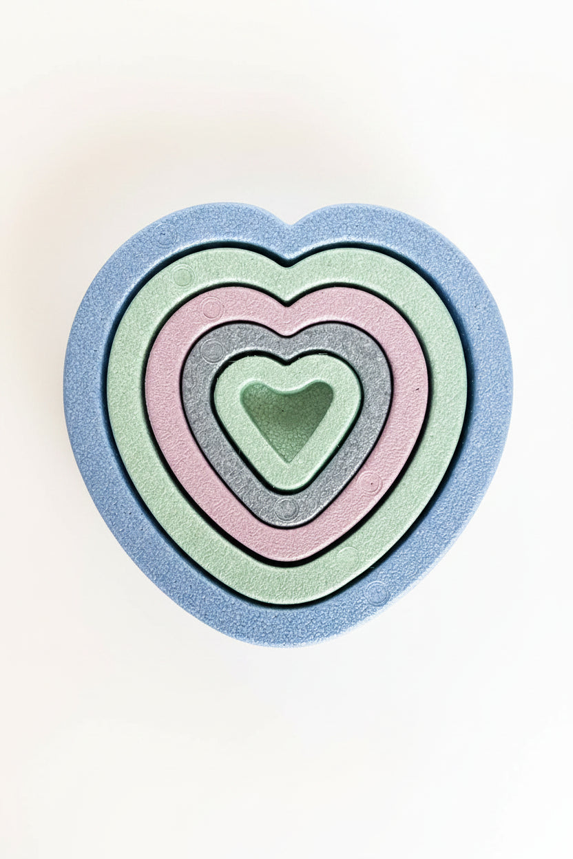 nesting hearts on stone background 