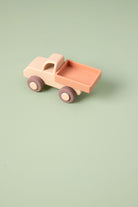 Silicone  toy truck on a light green background