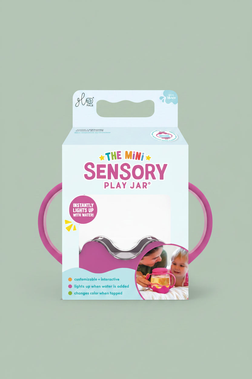 Package of 'The Mini Sensory Play Jar' with pink handles on a white background