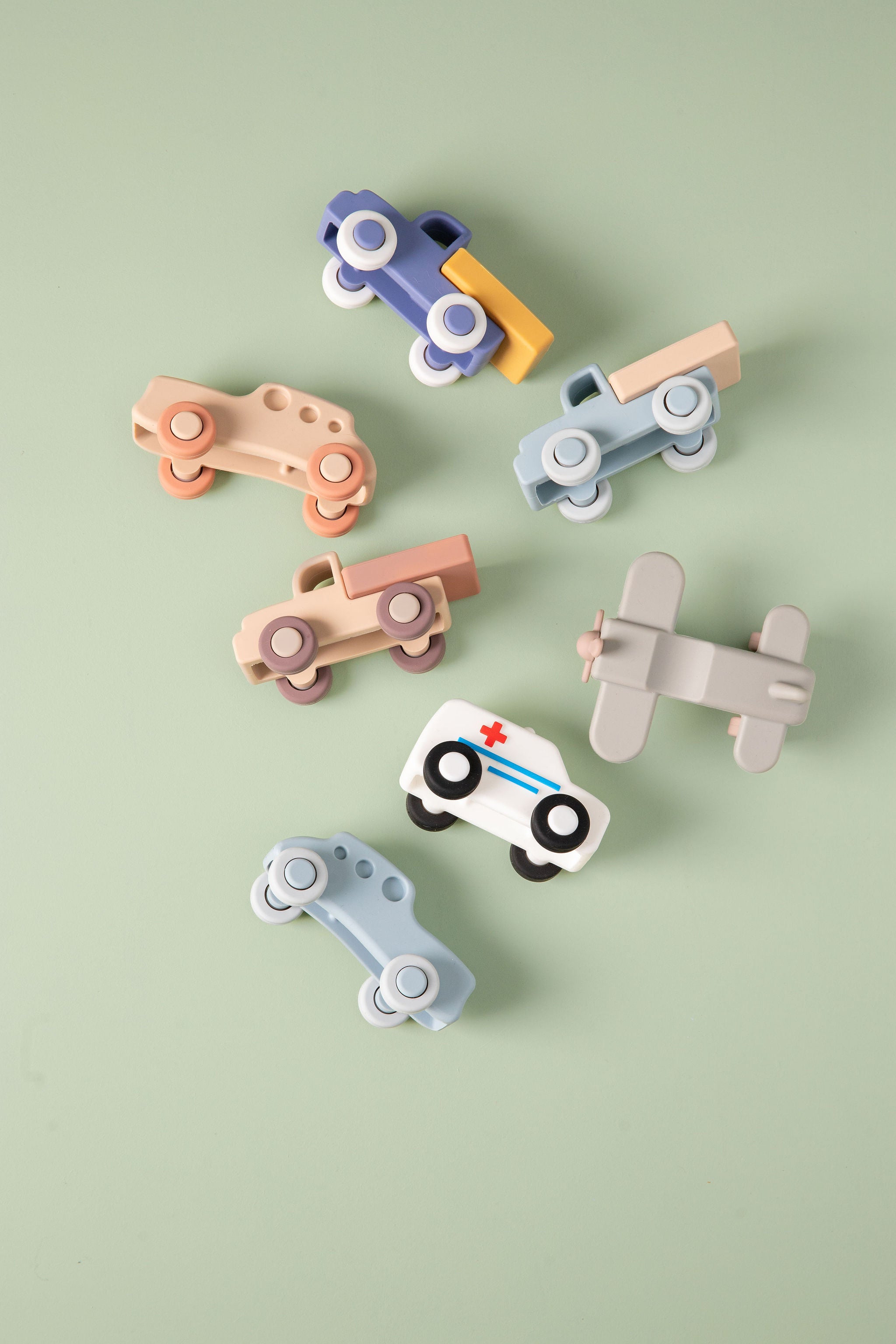 Set of silicone toy vehicles shown against a plain white background