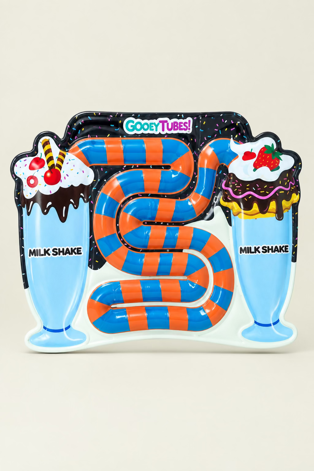 gooey tubes milkshake on beige background 