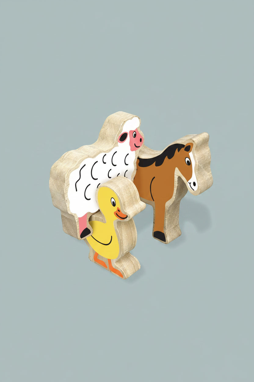 Wooden farm animal toy set featuring a sheep, duck, and horse with printed faces, shown on a blue  background with dimension callouts indicating 85mm height and 15mm thickness.