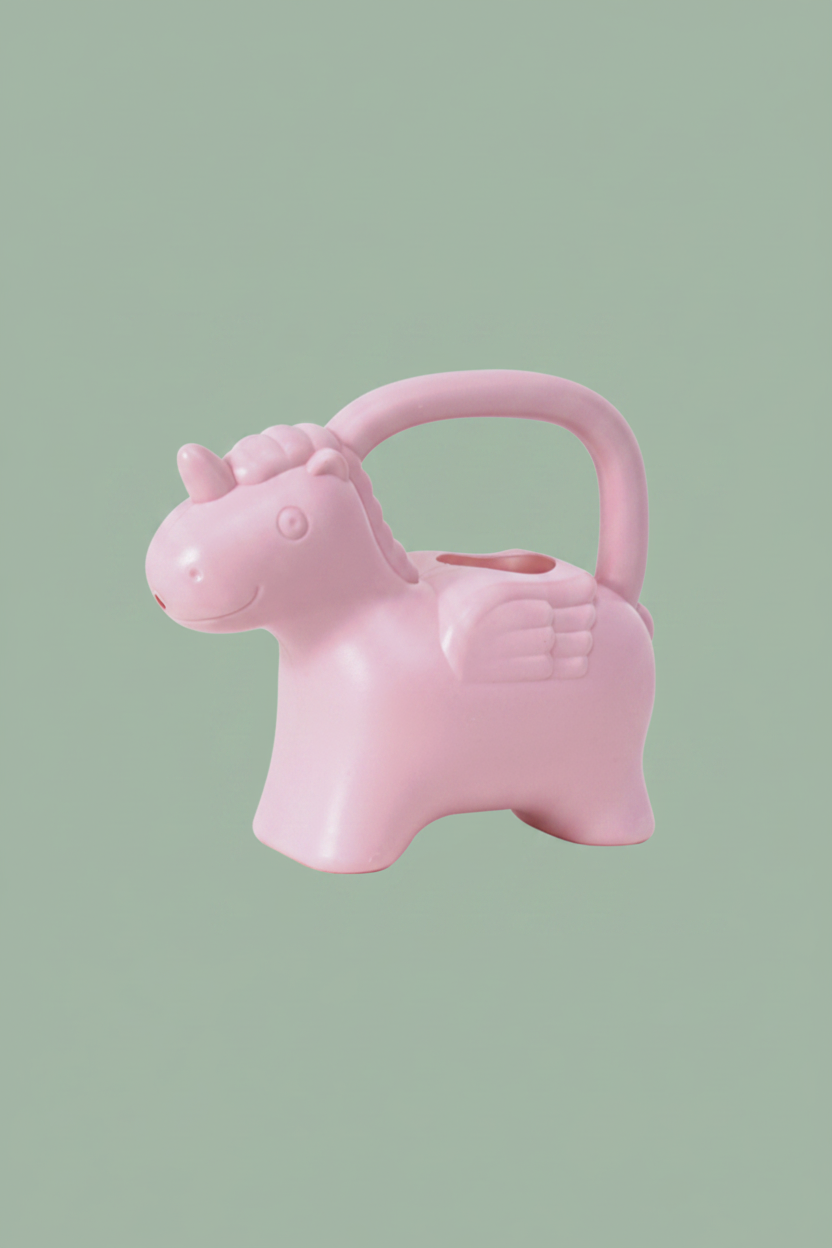 A light pink watering can shaped like a winged unicorn with a carrying handle, shown on a plain white background.