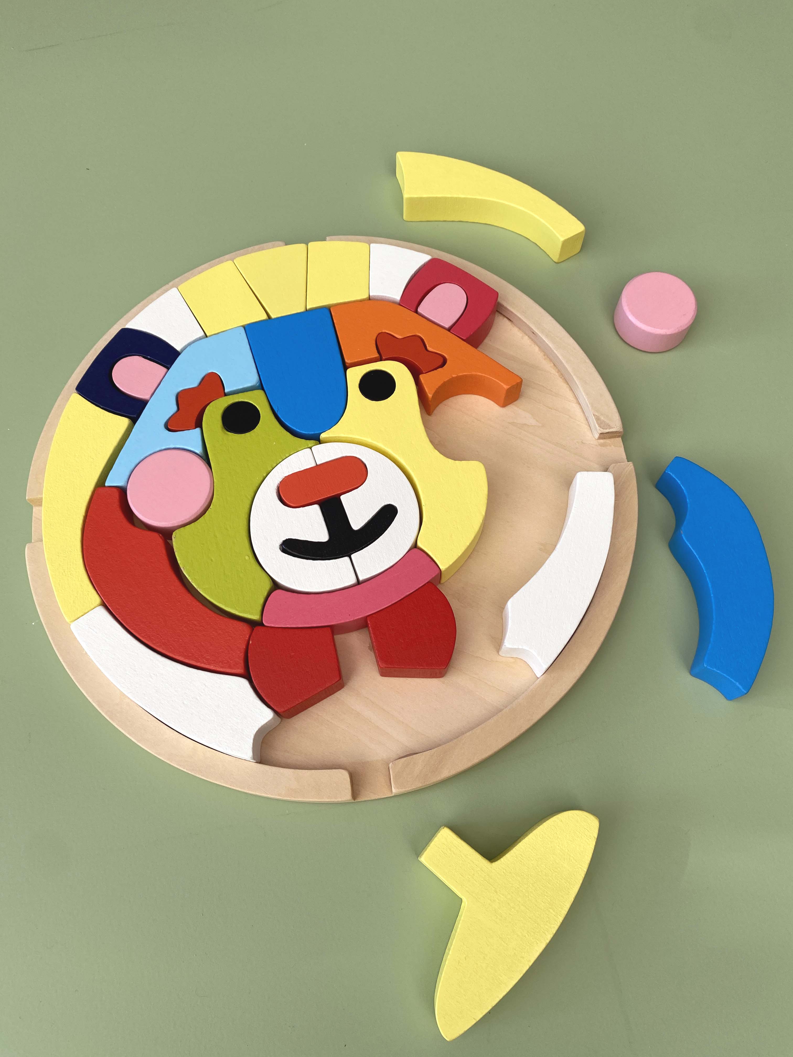 Child building with bear wooden blocks to develop fine motor skills and coordination