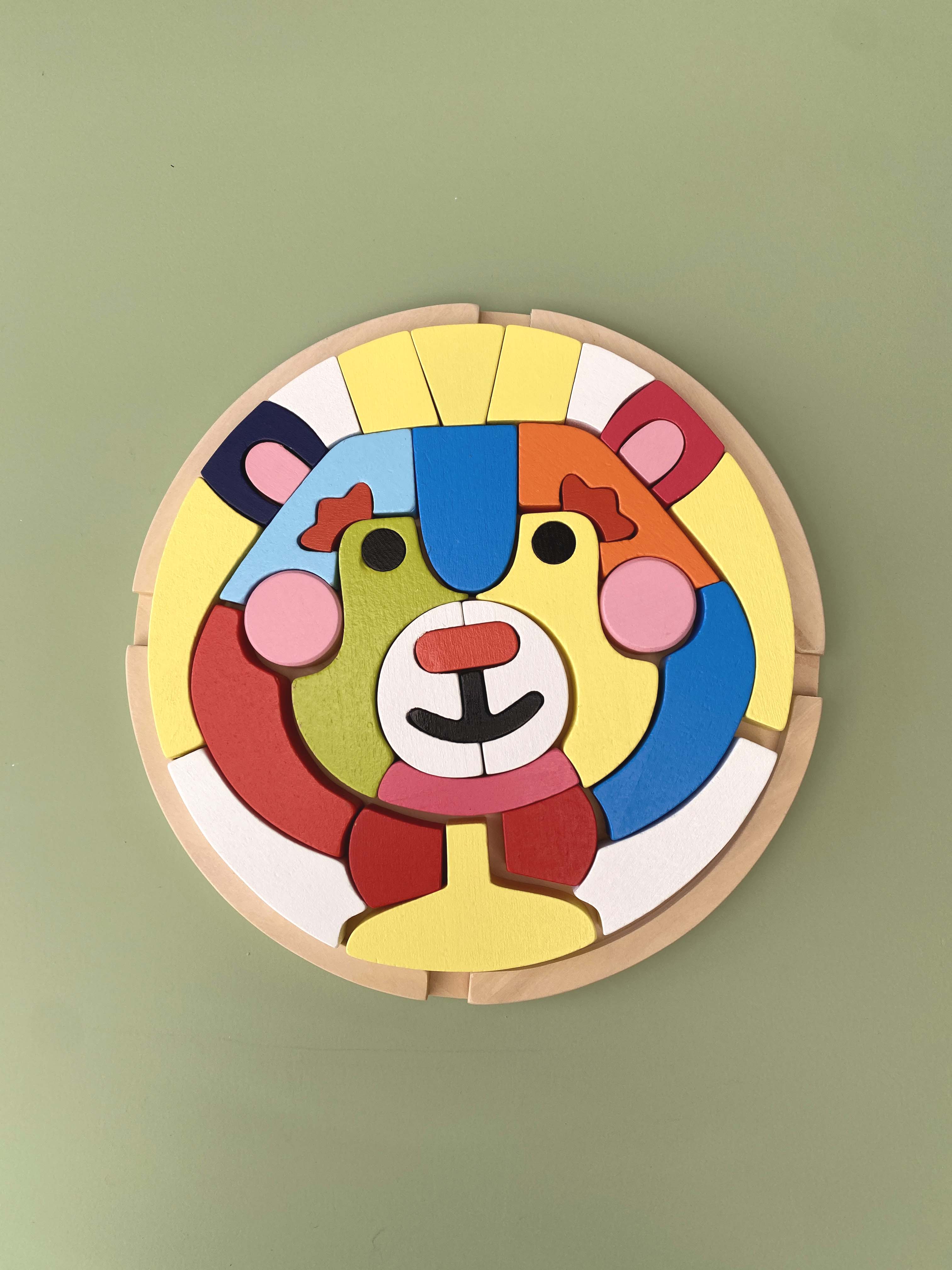 Child playing with wooden bear blocks for coordination and learning