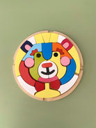 Child playing with wooden bear blocks for coordination and learning