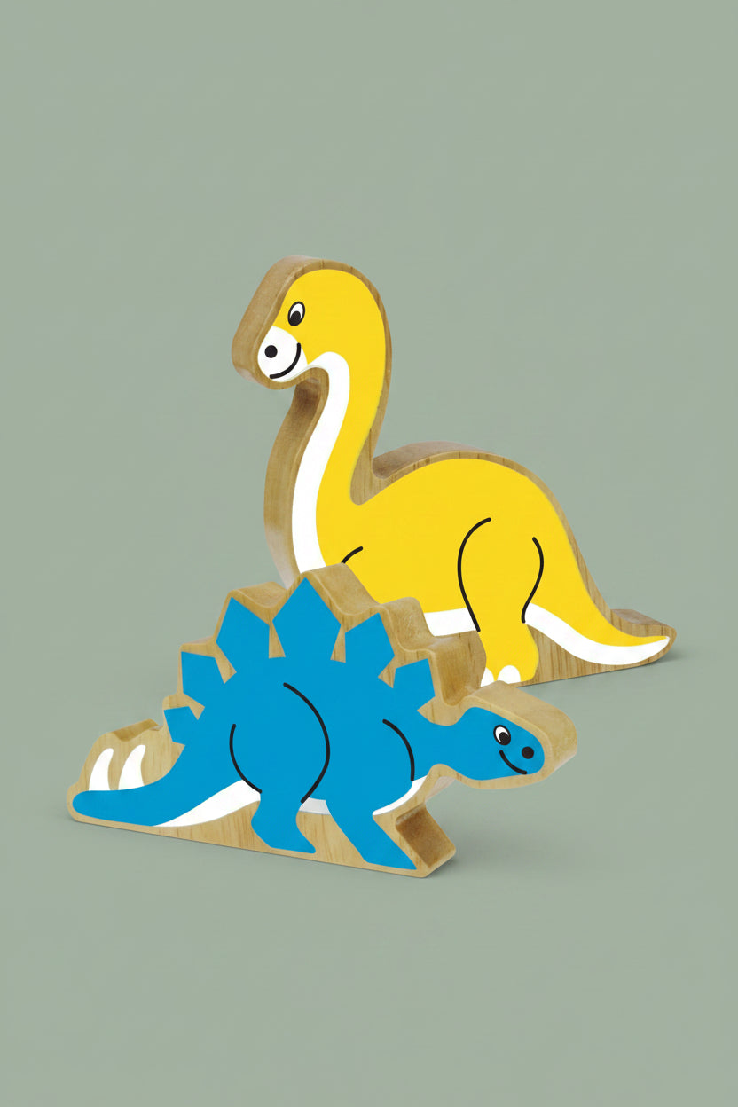 Two wooden dinosaur toy blocks, one yellow long-neck dinosaur and one blue Stegosaurus, shown on a plain white background.