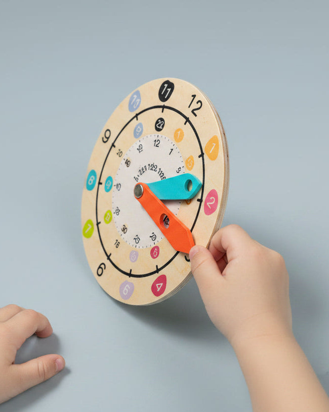 Close-up of wooden teaching clock face showing numbered dial and movable hands — OT-recommended time teaching toy