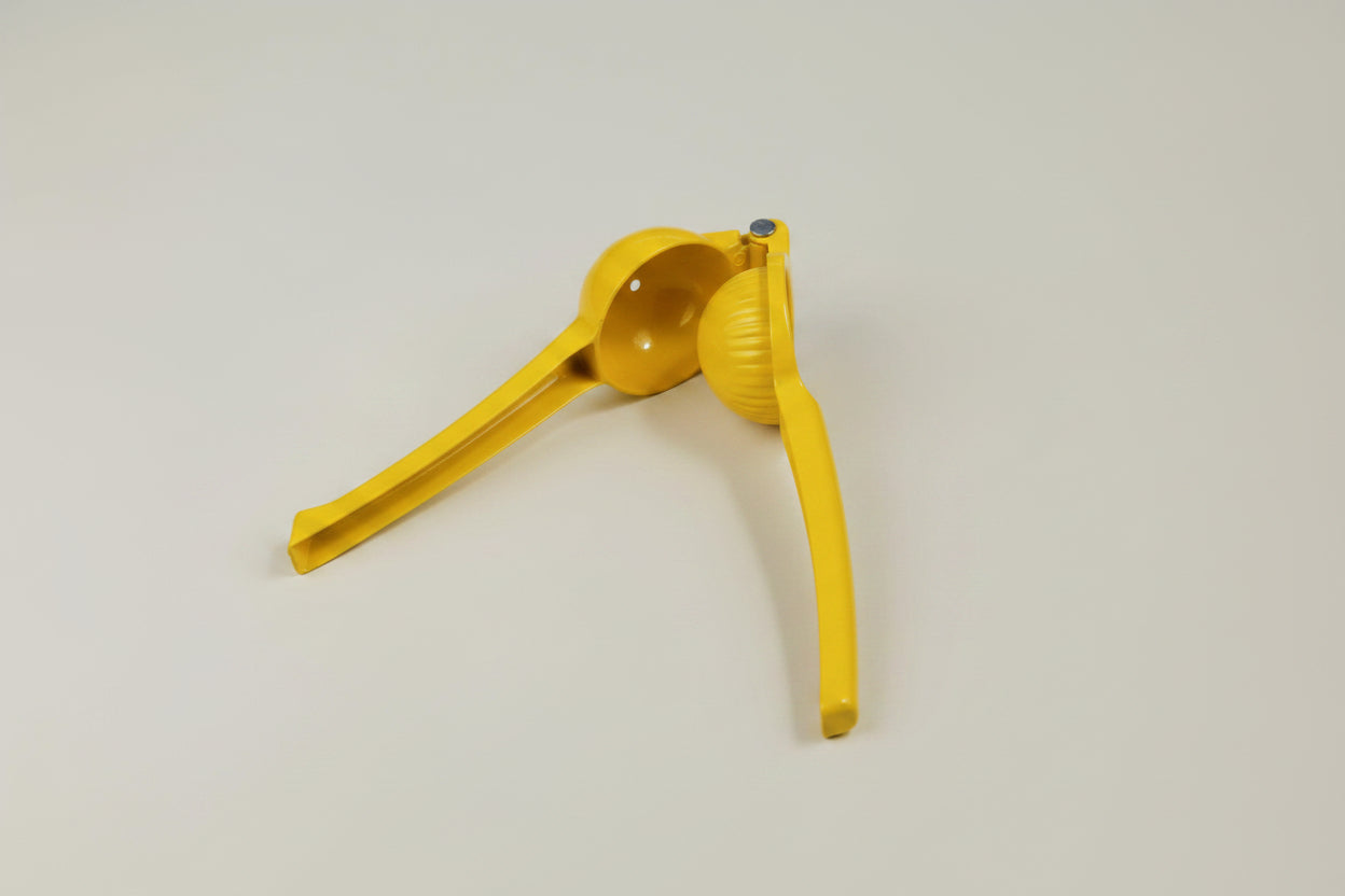 Yellow metal play dough squeeze tool, 19cm, standing upright against a plain background.