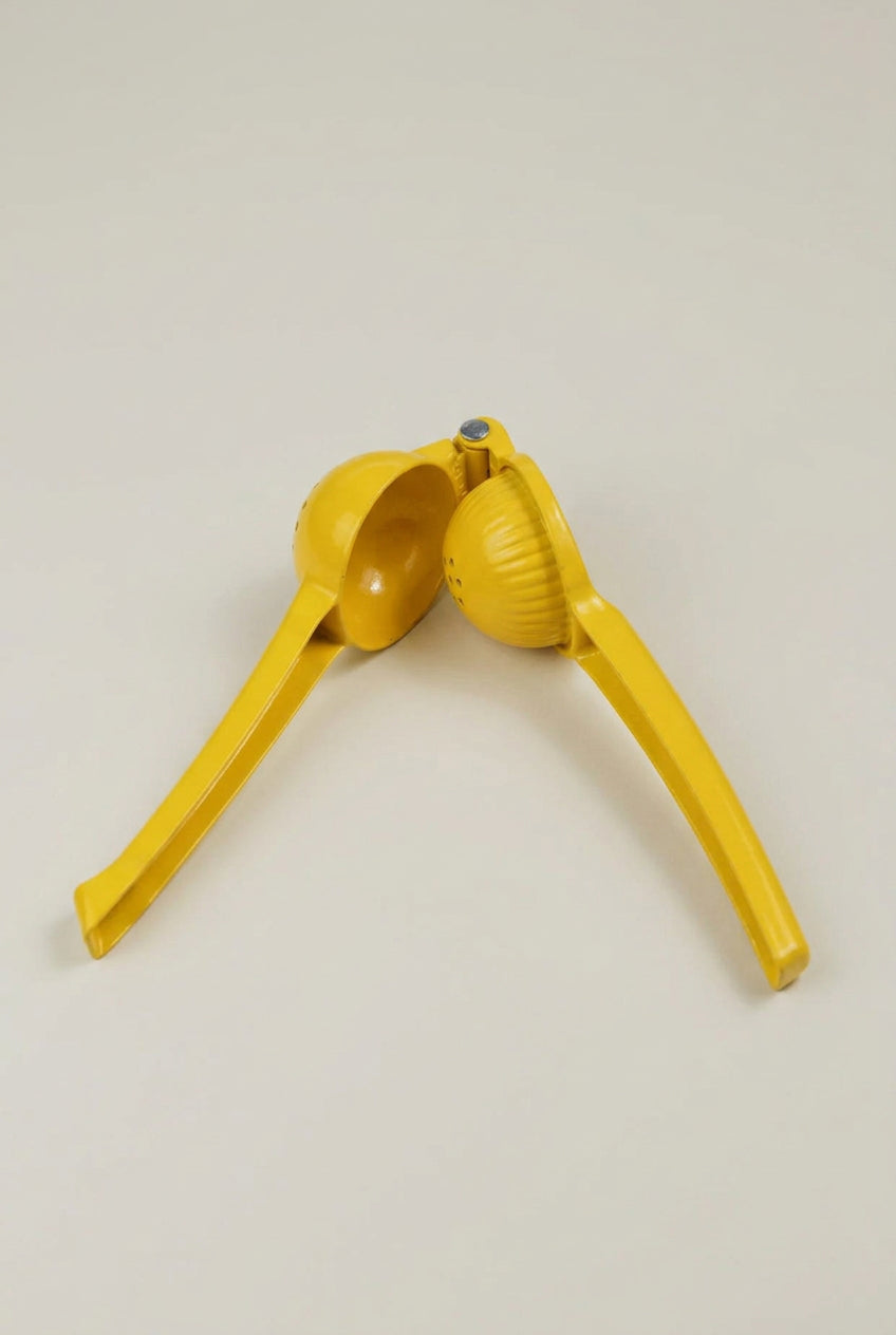 Yellow metal play dough squeeze tool, 19cm, standing upright against a plain background.