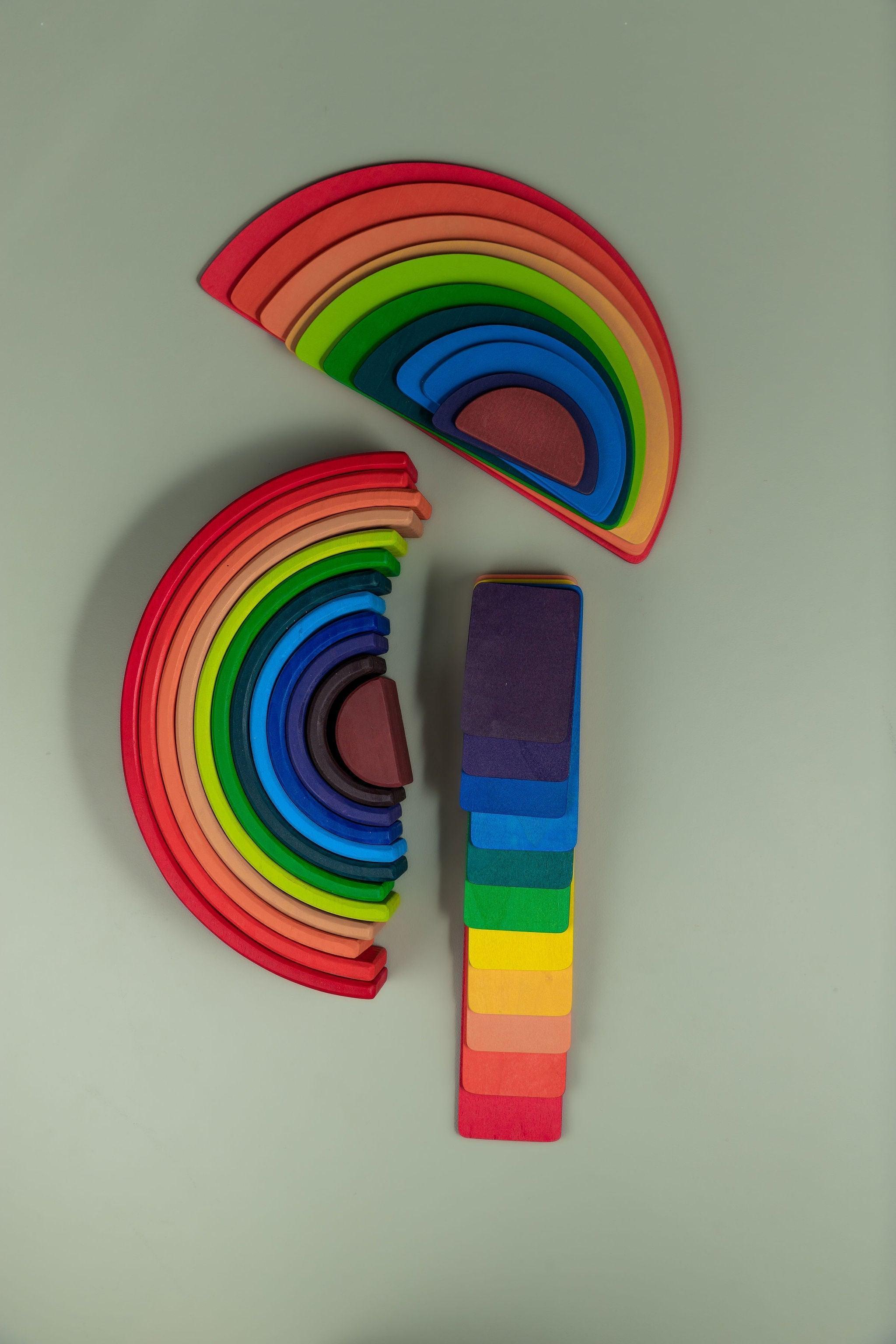 Full rainbow stacker set showing arches, strips, and semi-circle pieces together